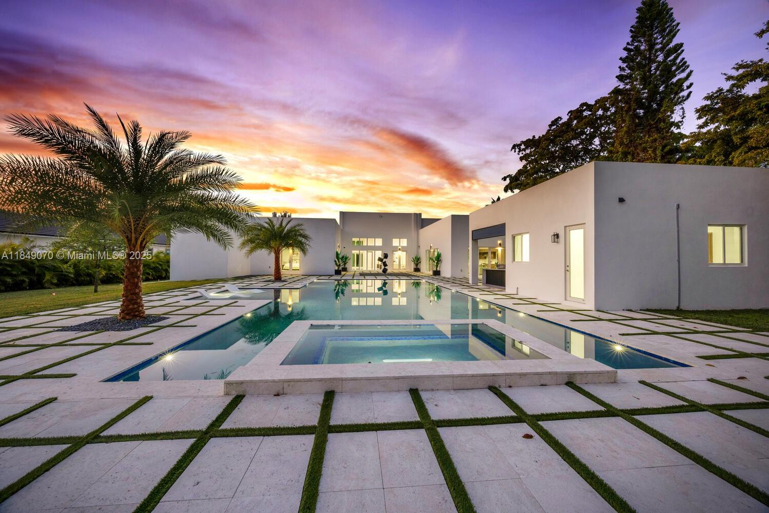 Stunning new construction one-story estate on a private 38,500 sqft lot with separate guest house, offering the perfect blend of modern luxury & everyday comfort. This meticulously crafted residence features 4 spacious bedrooms, a versatile den, 5 designer bathrooms & soaring 16-ft ceilings that enhance the expansive open layout. Floor-to-ceiling windows bathe the interiors in natural light, highlighting a sleek European-style kitchen with premium finishes, large island & stylish wet bar. The resort-inspired outdoor space includes a sparkling pool, spa & an impressive 1,000 sqft covered gazebo—ideal for entertaining or relaxing in style. A 3-car garage with ample storage completes this thoughtfully designed home, perfect for those seeking sophistication, space & the ease of modern living.