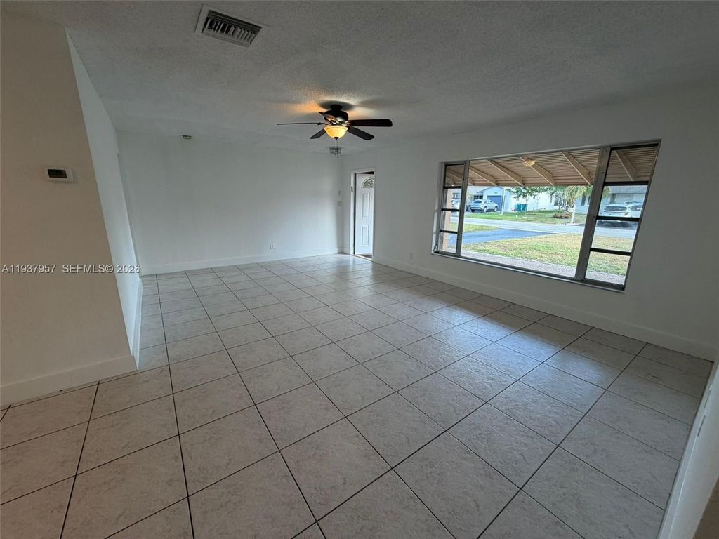 Photo of 9507 NW 80th Ct, Tamarac, FL 33321 (MLS # A11937957)