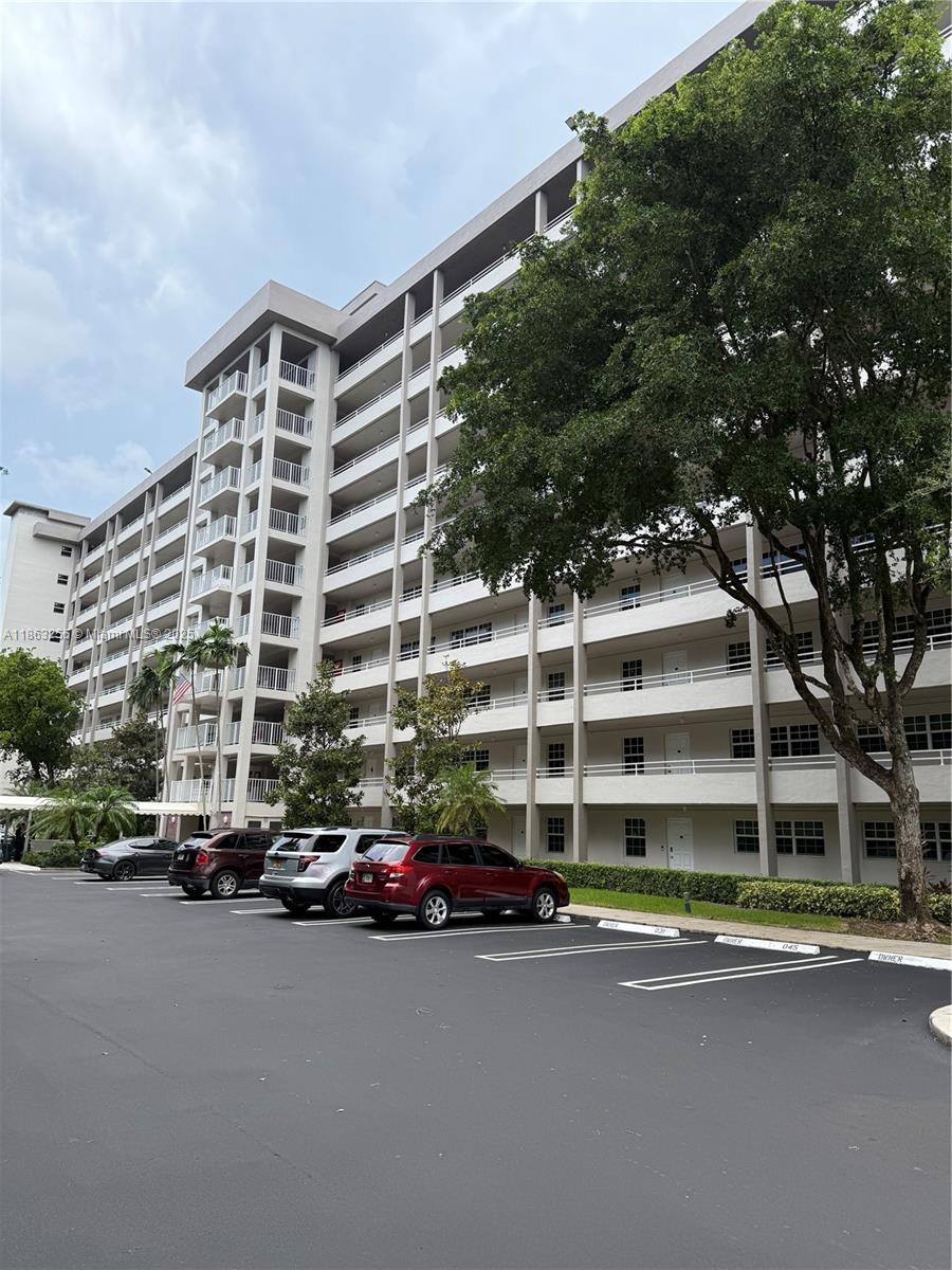 Welcome to this well-maintained 2-bedroom, 2-bathroom condo located in the desirable Palm Aire Country Club. Offering 1,064 square feet of comfortable living space, this home features a spacious private balcony with beautiful views of the Palm Aire golf course—perfect for relaxing or entertaining. Inside, you'll find an in-unit washer and dryer, keyless phone entry, and plenty of natural light throughout. The community provides resort-style amenities including a heated swimming pool, tennis and basketball courts, and a BBQ area. Security patrols offer added peace of mind. This unit comes with one assigned parking space and ample guest parking. Seller is motivated—don’t miss this great opportunity in a prime location to put your own personal touches on it.