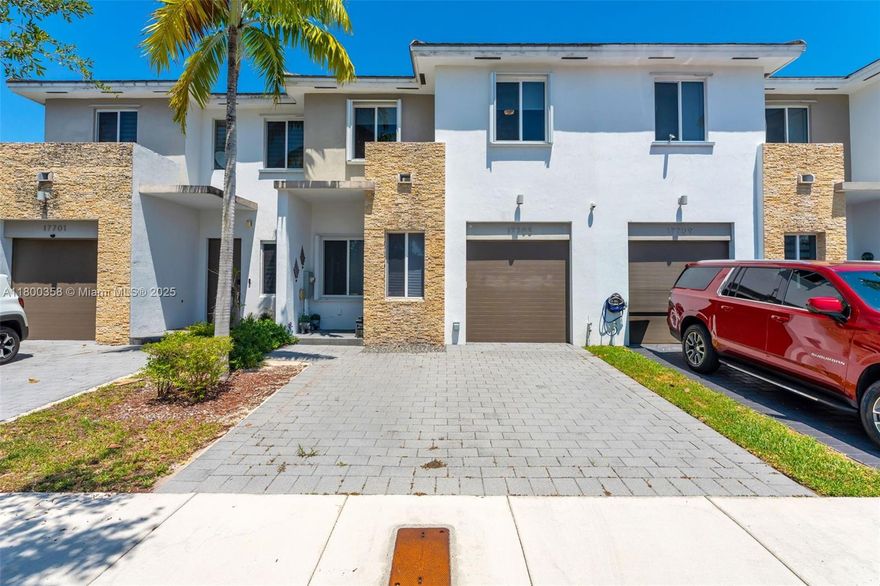 Discover refined living in this spacious 1,902 sq ft townhome, boasting 4 bedrooms and 3 full bathrooms. Enjoy the convenience of a first-floor bedroom with full bath, elegant tile flooring throughout the main level, and beautiful hardwood on the stairs and second floor (absolutely no carpet!). The modern kitchen features new, less than one-year-old appliances, including a washer and dryer. Step outside to a newly laid concrete backyard, perfect for container gardening. Added perks include an electric car charger outlet, a security system for peace of mind, ceiling fans in every room, and impressive 10 ft coffered ceilings. Upstairs, generously sized bedrooms with walk-in closets, and a large primary suite complete with two walk-in closets, a soaking tub, separate shower and double sinks.