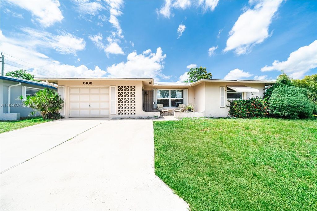 Photo of 5103 NW 54th Ct, Tamarac, FL 33319 (MLS # A11848023)