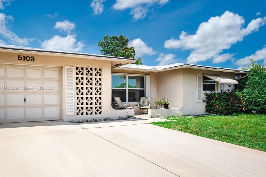 Photo of 5103 NW 54th Ct, Tamarac, FL 33319 (MLS # A11848023)