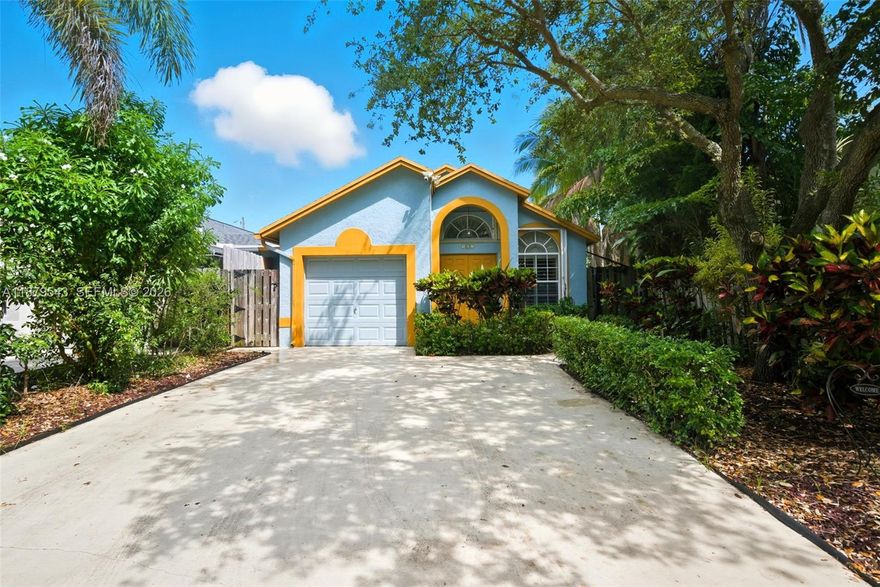 Don't miss out on this charming 3/2 single-story home offering 1,368 Total sq ft. Designed for owner occupancy & vacation ownership. Have convenience and style with no HOA restrictions. Step inside to find beautiful wood floors throughout, an upgraded impact front door, and added peace of mind with hurricane shutters. The functional layout includes a bright living space, dining area, and a well-appointed kitchen with new appliances. Enjoy privacy in your fenced backyard, with a large travertine-paved patio ideal for entertaining or relaxing. Solar panels to aid in energy efficiency. The 1-car attached garage adds extra storage and parking convenience. Easy access to shopping, dining, and major routes, this home offers the ultimate blend of hassle-free living and investment potential.