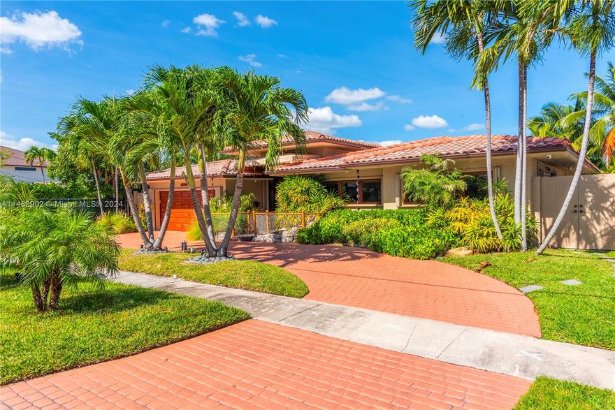 Nestled within the secure confines of the gated Keystone Islands, this residence epitomizes luxurious waterfront living. Waterfront the property bestows captivating Biscayne Bay views. Inside, the interior seamlessly marries modern elegance with timeless charm. The gourmet kitchen is equipped with top-tier appliances, resplendent quartz countertops, and a spacious butler’s pantry. The primary suite features picturesque water vistas, and a spa-like en-suite bath, creating a sanctuary of comfort. Outside, a dock extends a warm invitation to boating and fishing enthusiasts. With three generously appointed bedrooms, three exquisite bathrooms, a 2-car garage, and an abundance of storage space, this residence offers spacious living areas that beckon with sophistication and refinement.