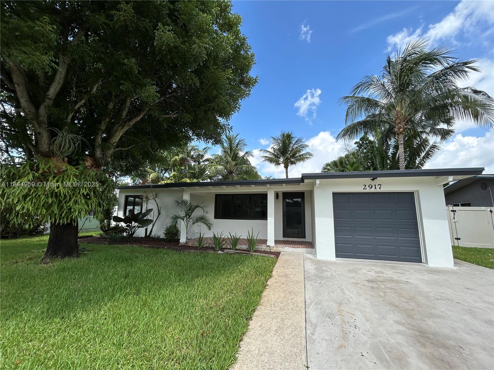 Beautiful Fully Remodeled Home in Wilton Manors. Seller to contribute $10,000.00 towards Buyer's Closing Costs. Perfect home for a couple or starter home. House has been fully done from top to bottom with New Hurricane Impact Windows and Doors, New Roof, New A/C, New Tile Flooring Throughout, New Quartz Construction, New Plumbing, New Electrical, and New Stainless Steel Appliances in the Kitchen. Backyard has a screened in porch wand plenty of space for a new pool to be built. Garage with new automatic door. This home is a hidden gem on a quiet street with great neighbors. House is located just minutes from Popular Wilton Drive, Restaurants, Schools, Shopping, and Fort Lauderdale International Airport.