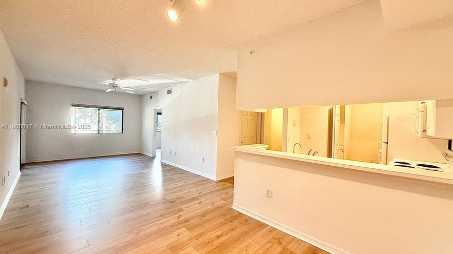 Excellent and very bright 2-bedroom, 2-bath condo featuring brand new wood laminate floors and freshly painted warm tones.The kitchen offers brand new stainless steel appliances, abundant cabinetry, and generous countertop space, ideal for cooking and entertaining. A private laundry room includes full-size washer and dryer. The spacious master bedroom has a large walk-in closet and ensuite bath. The second bedroom also has a walk-in closet plus an extra closet and direct access to the second bath. A screened balcony and impact windows provide comfort and convenience. Includes an exclusive storage in the outside hallway. Located in San Matera The Gardens, a gated community offering resort-style amenities with pool,spa,gym,saunas,tennis,pickleball, clubhouse, and lush landscaping throughout