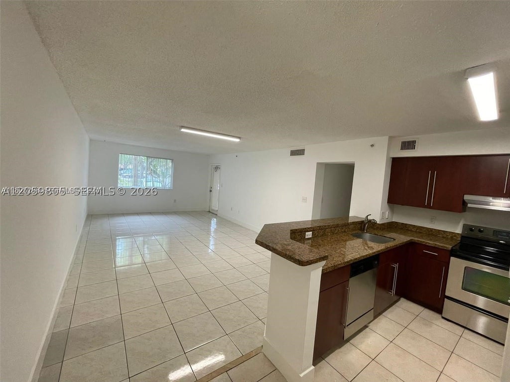 Photo of 761 N Pine Island Rd #104, Plantation, FL 33324 (MLS # A12059805)