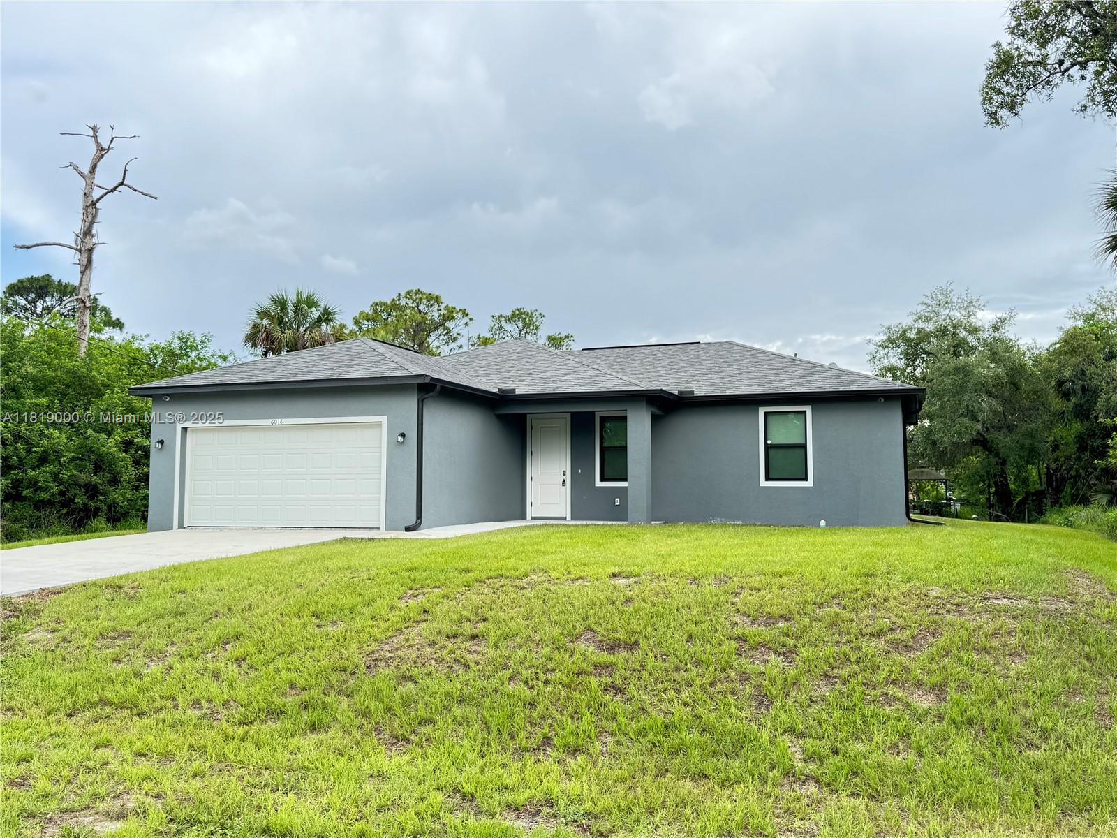 Charming house, 1 story Single Family Home located in a great community in Port Labelle FL. 3 Bedrooms, 2 full bathrooms, Dining Room, Living Room, Family Room, 2 Car Garage, Bay for 4 cars, Stainless steel appliances, Great Backyard. Move In Ready! Perfect for new families or those looking to down size. Cinder Block construction with impact resistant windows and doors. Sit out on your covered patio and relax in this lovely rural area.