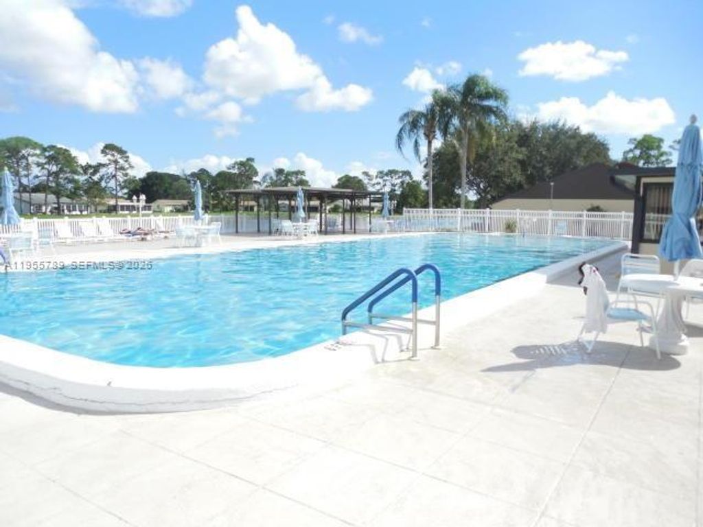 Photo of 441 SE Pine Glen Ln #A-2, Green Acres, FL 33463 (MLS # A11955789)