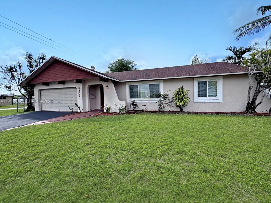 This spacious house is located on a corner lot within a cul-de-sac in the Rainbow Miramar area with 4 bedrooms and 2 bathrooms. The home features a bright interior with a functional layout that includes a living room, dining area, and family room that connect through a centrally located kitchen. The kitchen has been remodeled with white cabinetry, black granite countertops, and white appliances. The home has a split bedroom floor plan with the primary bedroom located on one side for added privacy. Bathrooms have been partially updated and the bedrooms feature wood style laminate flooring. House includes a spacious yard with room to add a pool. Additional improvements include a newer roof, newer A/C, and newer water heater. House is ready for it's new owner to make it their own. House is in a No HOA community and is conveniently located close to the Florida Turnpike, shopping, and dining.