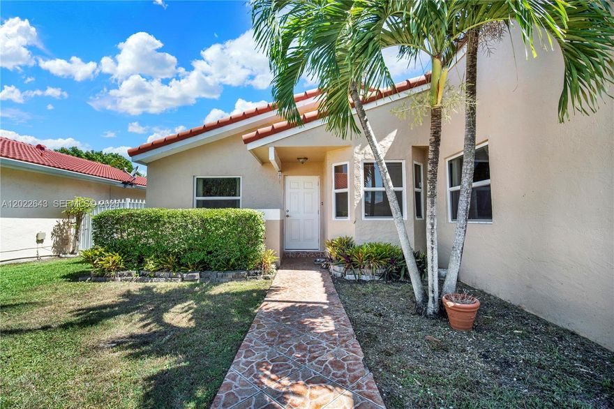 Great opportunity to own a 3 bedroom, 2 bath home in desireable area with important BIG TICKET UPGRADES  already COMPLETED, including hurricane impact windows and doors throughout, newer concrete tile roof, newer A/C and whole-home water filtration system. The interior could use some updating, or simply enjoy the home as it is while making improvements over time. The garage has been converted to a bedroom/home office and can be easily converted back. With its zero-lot-line design and manageable outdoor space, this home is well suited for buyers looking to downsize or enjoy lower-maintenance living in a convenient Miami location. Minutes from major transportation, shopping, dining and much more! Walking distance to Colonial Drive Elementary. Call for private showing today.