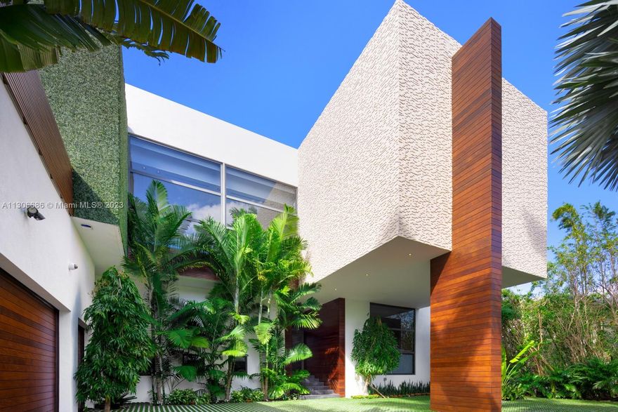 The Complete Contemporary Package on Lower North Bay Road with Western exposure and Downtown Views! Experience 25ft Library ceilings upon entry highlighted by Apure & Henge Lighting. Siberian Oak & limestone flooring and Venetian stucco walls create a neutral aesthetic enhanced by bold features such as Dornbracht rose gold primary suite fixtures & a dramatic noir Italkraft kitchen. The culinary suite includes a wine cellar, prep kitchen, dual islands. The floorplan flows divinely to include 6 upstairs bedrooms. Outdoor amenities showcase a 103ft mosaic pool + spa, massage pavilion, Summer Kitchen, and rooftop terrace accessible by elevator. Crestron automation and security system too. Boaters: 100 feet of frontage + dock + boat lift. Live minutes from all that Sunset Harbour has to offer.