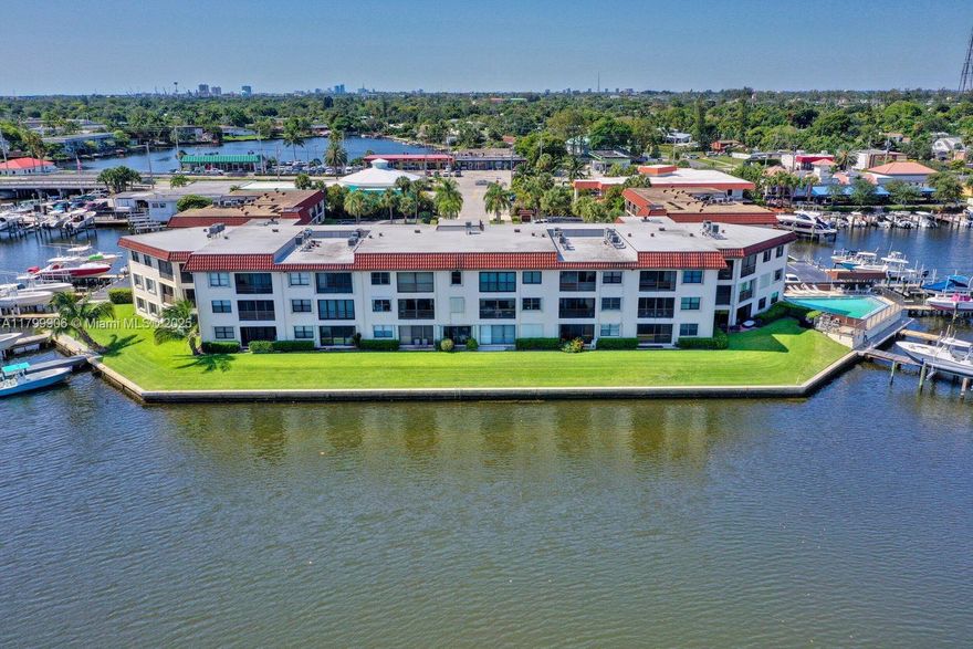 Enjoy the amazing unobstructed water view from all the main living areas! Have coffee or a cocktail on the patio while watching the fish jump in this section off the Earman River. Move right into this totally remodeled 2 bedroom/2 bath condo with modern styling. This lower level unit with parking right out front of the unit is short distance to the water. New black stainless steel Frigidaire Gallery appliances accent the stunning backsplash, quartz countertops with waterfall edge, tons of kitchen storage. All new led lighting throughout, completely remodeled baths, new AC, and new vinyl flooring. Building includes pool overlooking the water and storage unit. Kyak over to Anchorage Park. Minutes to Freedom Boat Club, marina, golf, tennis, pickleball, shopping and dining.
