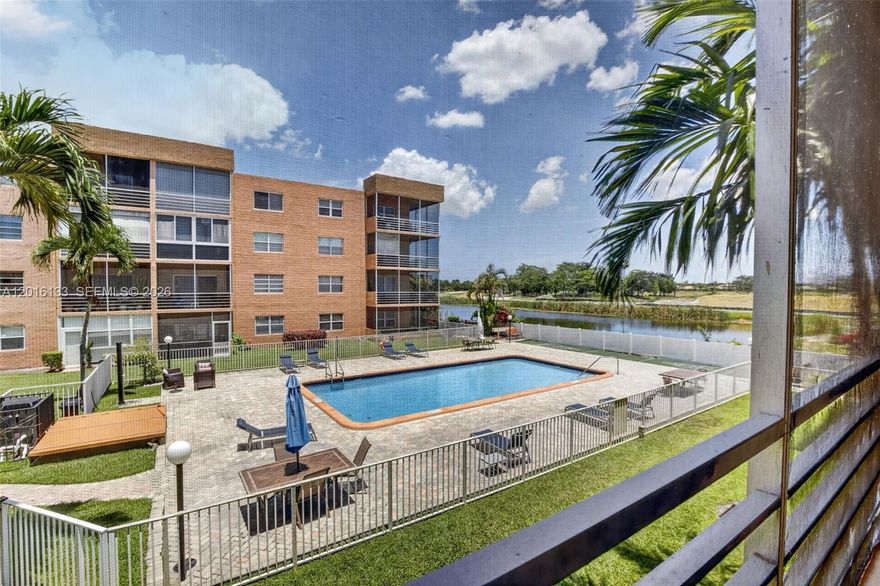 Enjoy year-round sunshine, warm breezes, and the best of South Florida living from this bright 2-bedroom, 2-bath condo in Sunrise Lakes. With 896 sq ft, this well-kept home offers comfortable, low-maintenance living in a desirable 55+ community with peaceful pool, lake, and lush garden views. The large screened balcony creates a true indoor-outdoor space, perfect for morning coffee, relaxing evenings, and enjoying the Florida lifestyle. Inside, you’ll find plush brand-new carpet, a new primary vanity, a walk-in closet in the primary bedroom, a vintage-style secondary bath, and a functional kitchen with durable countertops, a brand-new dishwasher, and a refrigerator less than a year old. Additional value comes with a 2022 A/C system for added comfort and peace of mind. Affordability meets value in a well-maintained building featuring a new roof, new elevators, and a refinished heated pool- with assessment paid by seller. Sunrise Lakes offers clubhouse amenities, tennis, pickleball, shuffleboard, pools, social activities, and convenient shuttle service. Convenient to Sawgrass Mills, beaches, Amerant Bank Arena for NHL hockey, concerts, and major events, plus dining, shopping, and highways. Nearby Sunrise Civic Center offers arts, recreation, fitness, aquatics, and community events in a 100,000+ sq ft facility. Residents love the community feel, open spaces, winding sidewalks, grassy areas, & plenty of activities and neighborly gatherings.