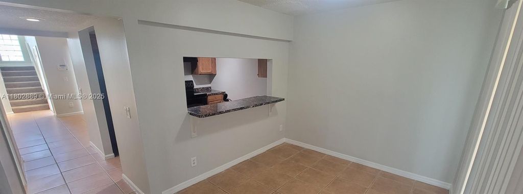 Photo of 5140 Elmhurst Rd #E, West Palm Beach, FL 33417 (MLS # A11802889)