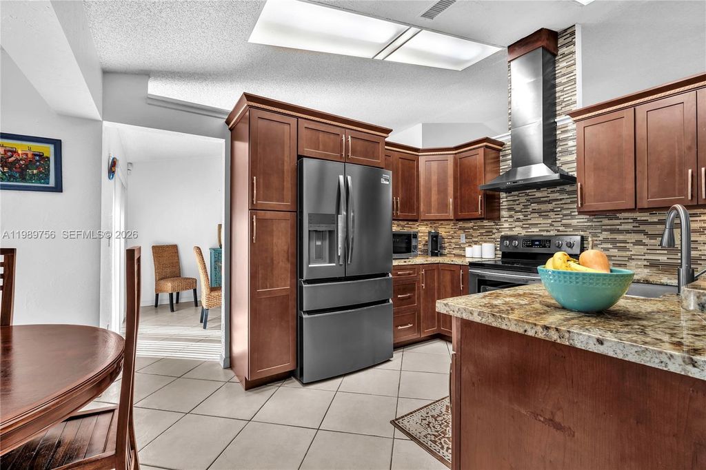 Photo of 9300 NW 32nd Mnr, Sunrise, FL 33351 (MLS # A11989756)