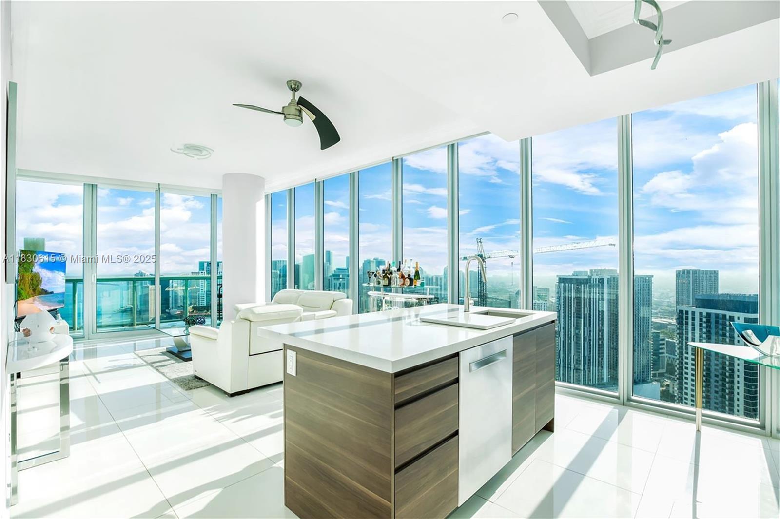 Step into this stunning 2 Bed condominium situated in the 01 line on the 53rd floor.. Captivating views span across the Miami skyline and provide direct ocean perspectives of Biscayne Bay, Miami Beach, as well as the dazzling city lights of Brickell and the Miami World Center. Positioned at the southeast pinnacle of the building, Line 01 holds the coveted status of being the most sought-after within Marina Blue. This unit underwent a comprehensive transformation, featuring brand-new crown molding & fully renovated kitchen boasts top-of-the-line Bosch appliances, quartz backsplash, new cabinets, and includes a $1,500 Woodbridge toilet bidet in the master bathroom. Additional highlights comprise built-in closets, all-electric switches, automatic blinds, and custom lighting installations!