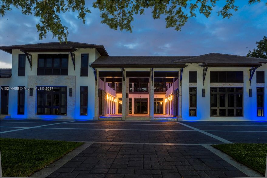 5745 Tropicale Modern, featured on CBS's "Living Large" is 9 BD+12 BA masterwork of contemporary style/luxury exuding S. FL lifestyle: privacy, resort ambiance, car-aficionado's paradise and an entertainer's dream. Situated on 2 lush acres, sprawling home features front water pool, sky-high ceilings, 3 massive master suites, enormous indoor/outdoor kitchens, teppanyaki grill, bbq, bar, top of the line appointments. Brainchild of Pioneer InterDevelopment, Pinecrest's trailblazer & exquisite craftsmanship.