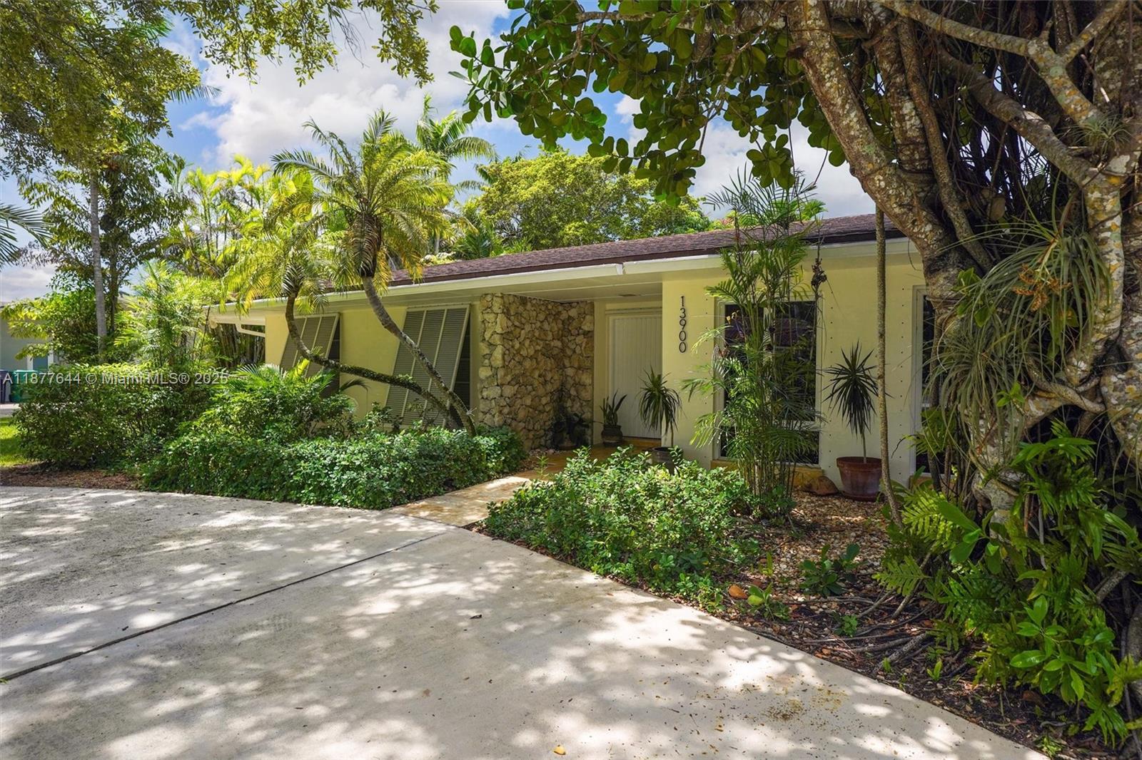 Bright, airy Mid Century pool home in North Palmetto Bay. Quiet street, close to 136th & Old Cutler. Home features freshly painted exterior, 4 bed 2.5 bath & spacious layout. Lrg open kitchen w/counter seating. Family rm adjacent to kitchen overlook pool & patio. Formal living and dining rms with garden views. Separate lrg den/library with wood burning fireplace. Split bedrm floorplan. Large primary bedrm with adjacent office. Updated primary bathrm w/custom cabinetry. 3 additional lrg bedrooms. Updated second full bath. House includes: walk in pantry, lrg hall closet, bedrms w/closet built- ins, indoor laundry & storage/craft rm, 1 car garage, old Chicago brick patio. Mature landscape. Audio speakers in living rms & patio. Top rated Palmetto schools, near Coral Reef Park. Owner/agent.