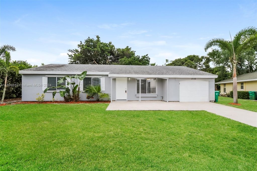 Photo of 1750 SE Elkhart Ter, Port Saint Lucie, FL 34952 (MLS # A11699852)