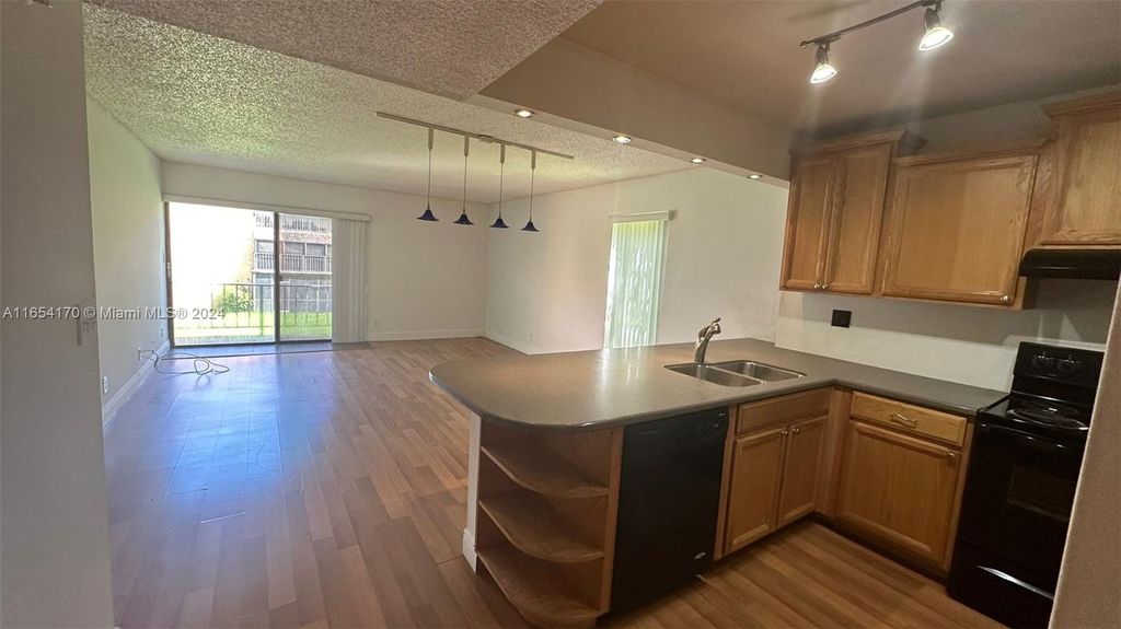Photo of 430 Commodore Dr #208, Plantation, FL 33325 (MLS # A11654170)