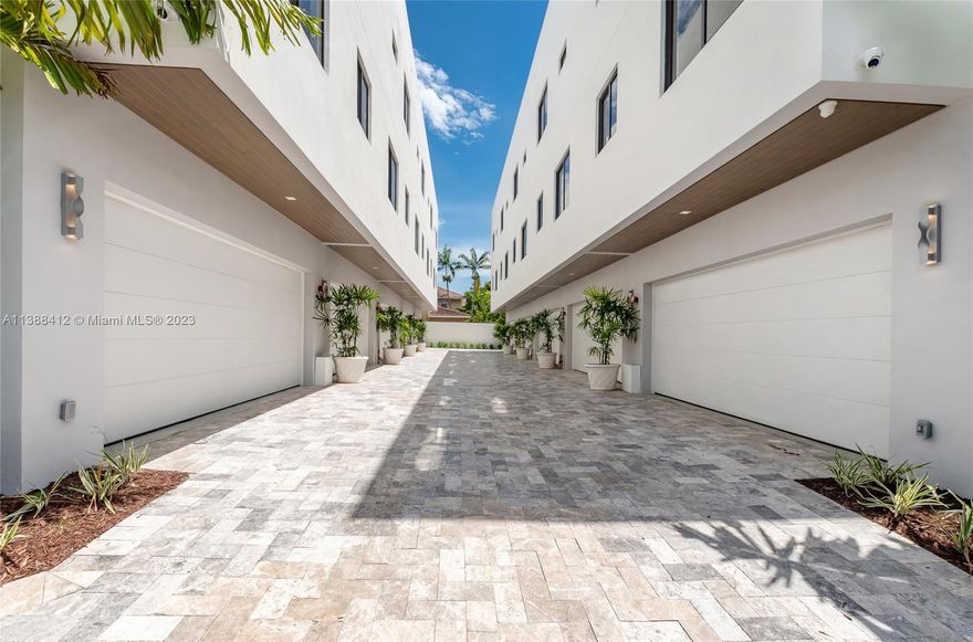 These 3/3 Townhomes offer state-of-the-art features like European cabinets and doors, Bosch appliances, washer/dryer, electric shades, 2-car garage with Tesla charger, high-speed internet, 12 outdoor surveillance cameras, app-accessible alarm, rooftop terrace with summer kitchen. Centrally located, only 1 minute away from US1, providing easy access to major roads. It is also conveniently located within a short drive to various popular destinations. Merrick Park Mall and CocoWalk are just 5 minutes away, while Miracle Mile and Brickell can be reached within a 10-minute drive.