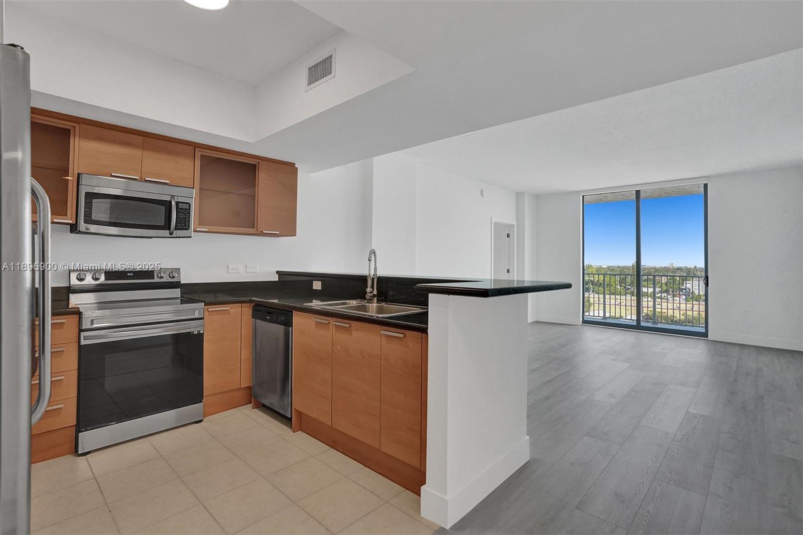 Amazing 2-bedroom, 2-bathroom unit located on the 8th floor of the desirable Hollywood Station Condominium, offering stunning skyline views. Enjoy a split floor plan with an open, full-sized kitchen featuring stainless steel appliances, granite countertops, and an in-unit washer and dryer. Perfectly situated within walking distance to shops, dining, parks, and entertainment, and just minutes from the beach. Excellent access to major highways and only 15 minutes from Fort Lauderdale Airport. Building amenities include a fully equipped gym, billiards room, clubroom, resort-style pool with open sundeck, relaxing spa, and valet parking.