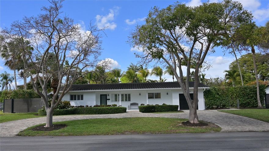 Escape to your own private tropical oasis in the heart of Palmetto Bay’s favorite golf cart-friendly neighborhood. This charming 3-bedroom, 2-bathroom home sits on a massive, nearly 15,000 sq ft lot, where the backyard serves as a lush sanctuary complete with a sparkling pool, towering palms, and mature mango and avocado trees. The outdoor space is a true island-style retreat, featuring a covered patio perfect for relaxing by the water in total seclusion. Inside, the home features a split floor plan with a spacious master suite boasting a large walk-in closet and en-suite bath. The kitchen is outfitted with marble countertops and stainless steel appliances, blending classic charm with modern functionality. Beyond the tropical landscape, there is ample room to park a boat or RV, as well as significant space to expand the home on this oversized lot, all while being located just minutes from top-rated schools, parks, and shopping.The home includes impact windows and updated plumbing.