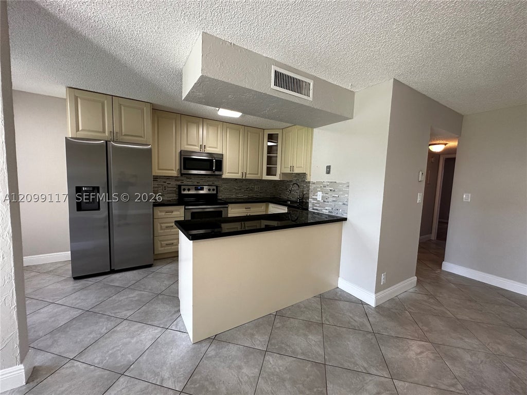 Photo of 5515 Courtyard Dr #5515, Margate, FL 33063 (MLS # A12099117)