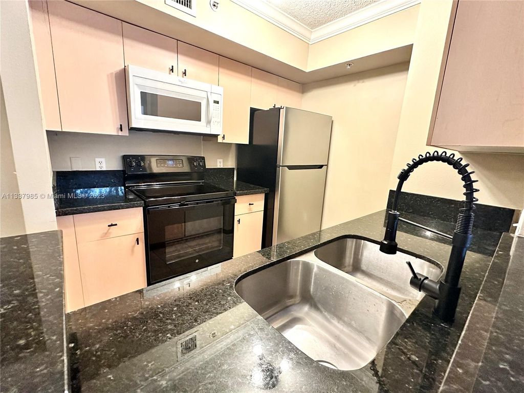 Photo of 2457 Centergate Dr #207, Miramar, FL 33025 (MLS # A11337985)