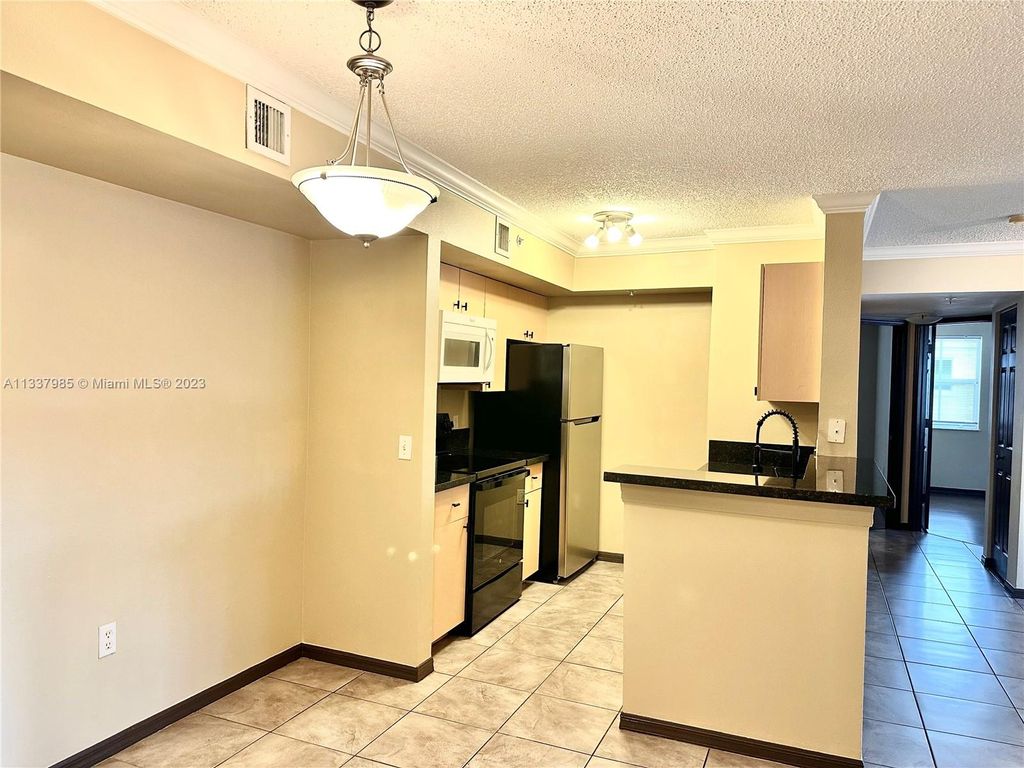 Photo of 2457 Centergate Dr #207, Miramar, FL 33025 (MLS # A11337985)