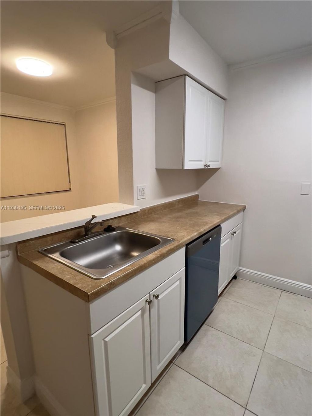 Photo of 2880 N Oakland Forest Dr #107, Oakland Park, FL 33309 (MLS # A11930195)