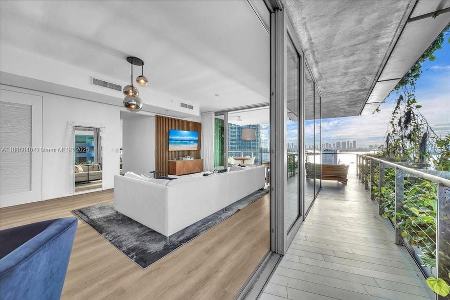 Enjoy breathtaking sunrise & sunset views from this flow-through corner residence at Monad Terrace, designed by Pritzker Prize winner Jean Nouvel. A private elevator opens into this three-bedroom, three-and-a-half-bath home in the sky, with floor-to-ceiling sliding glass doors and a fifteen-foot-deep wraparound terrace framing sweeping views of the Downtown Miami skyline, Biscayne Bay, & South Beach.

The kitchen features Gaggenau appliances and Calacatta marble countertops, creating a striking setting for entertaining. The primary bathroom offers a steam shower and soaking tub with bay views. 

Monad Terrace is an architectural jewel of just 59 homes, surrounded by a central lagoon and lush climbing gardens. Bayfront pool, jacuzzi, & gym. Close to Sunset Harbour & South of Fifth.
