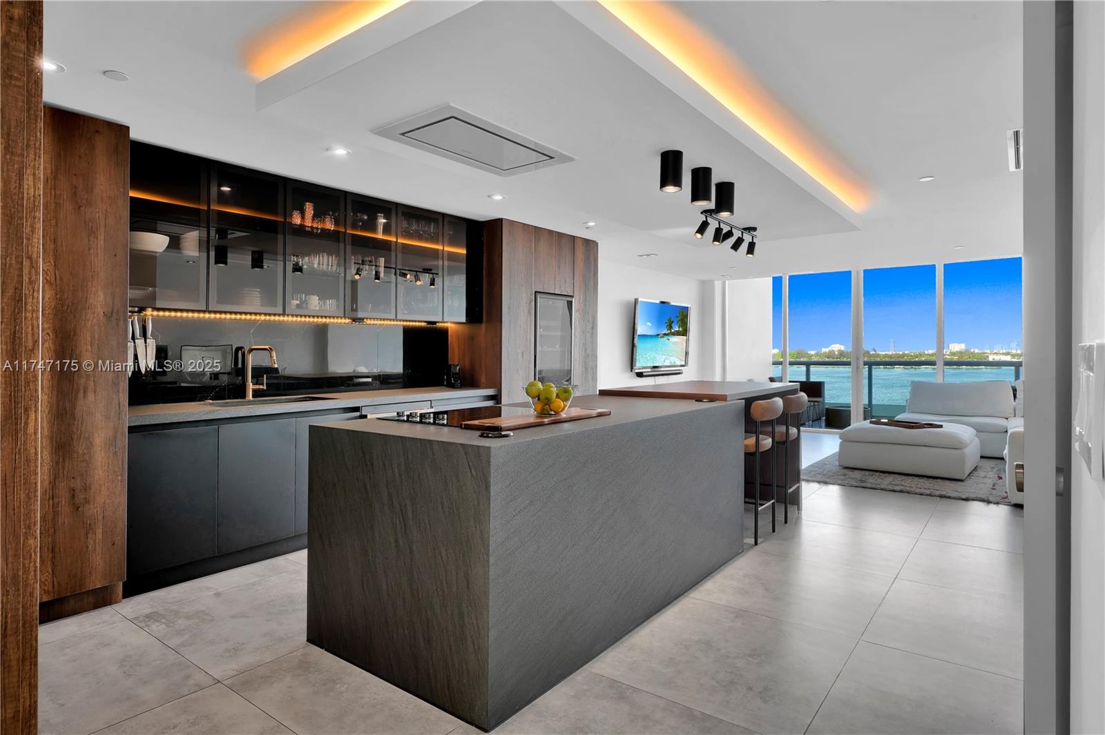 Presenting a spacious 2-story Bayfront condominium in the sought-after Cielo on the Bay. This beautifully remodeled residence features a contemporary European kitchen equipped with high-end JennAir appliances and porcelain flooring throughout. Enjoy the waterfront en-suite bedrooms and large balconies on both levels that provide stunning views. This property includes 2 covered parking spaces and access to a community dock, plus it’s dog-friendly. Amenities feature a rooftop pool and Jacuzzi with panoramic views, a fitness center, sauna, and concierge service. Conveniently located just minutes from the ocean, Bal Harbor shops, restaurants, and parks, this condo offers a comfortable and elegant living experience. Don't miss your chance to own this exceptional home!