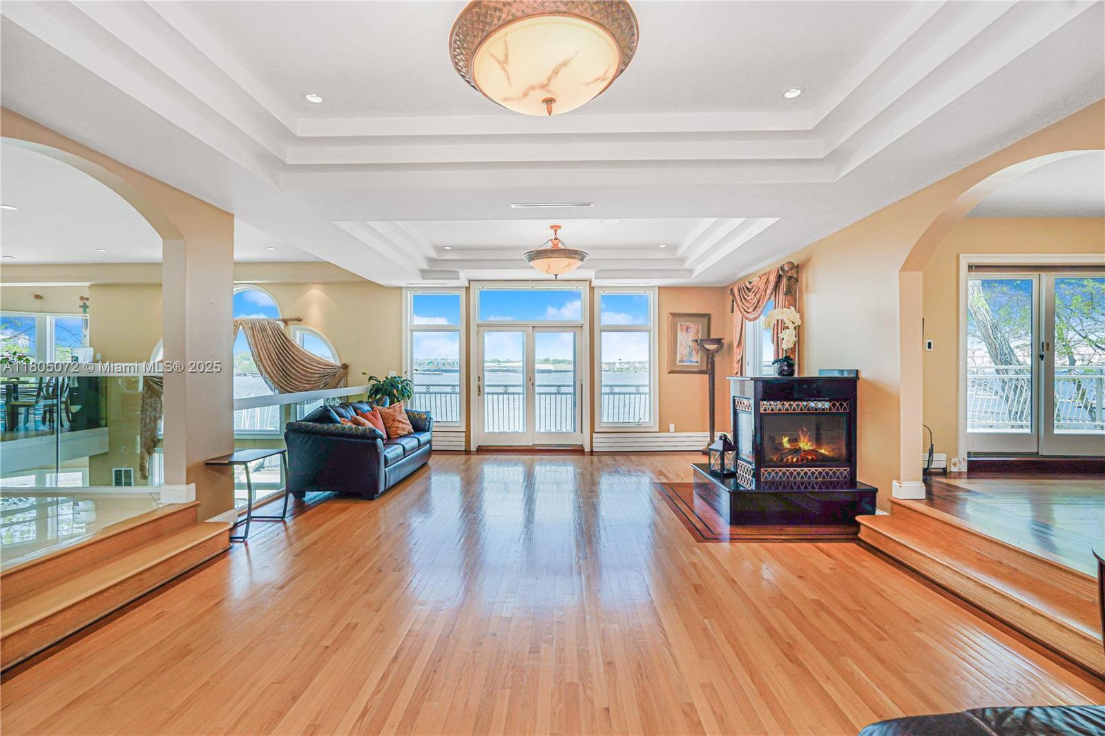 Exceptional 1.5-acre waterfront estate on Staten Island just 40 mins by boat to Manhattan. With 700 ft of water rights, this private oasis is a dream for boaters and beach lovers alike. Featuring 4 beds, 5 baths, 3 kitchens, cinema, gym, heated pool, and 5 ocean-view decks. Entertain outdoors with dual grills, wet bar, smoker, and TVs. Private dock fits 3 boats & 2 jet skis. Enjoy a sunset Jacuzzi, driving range, basketball court, and firepit. Ground-level suite offers a full kitchen, bar, and steam bath. Custom hardwood floors, solar panels, 400-amp electric, and whole-property Wi-Fi. Newer roof & lifetime warranty boilers. Rare blend of privacy, luxury, and location. Don’t miss this one-of-a-kind coastal retreat—schedule your private tour today!