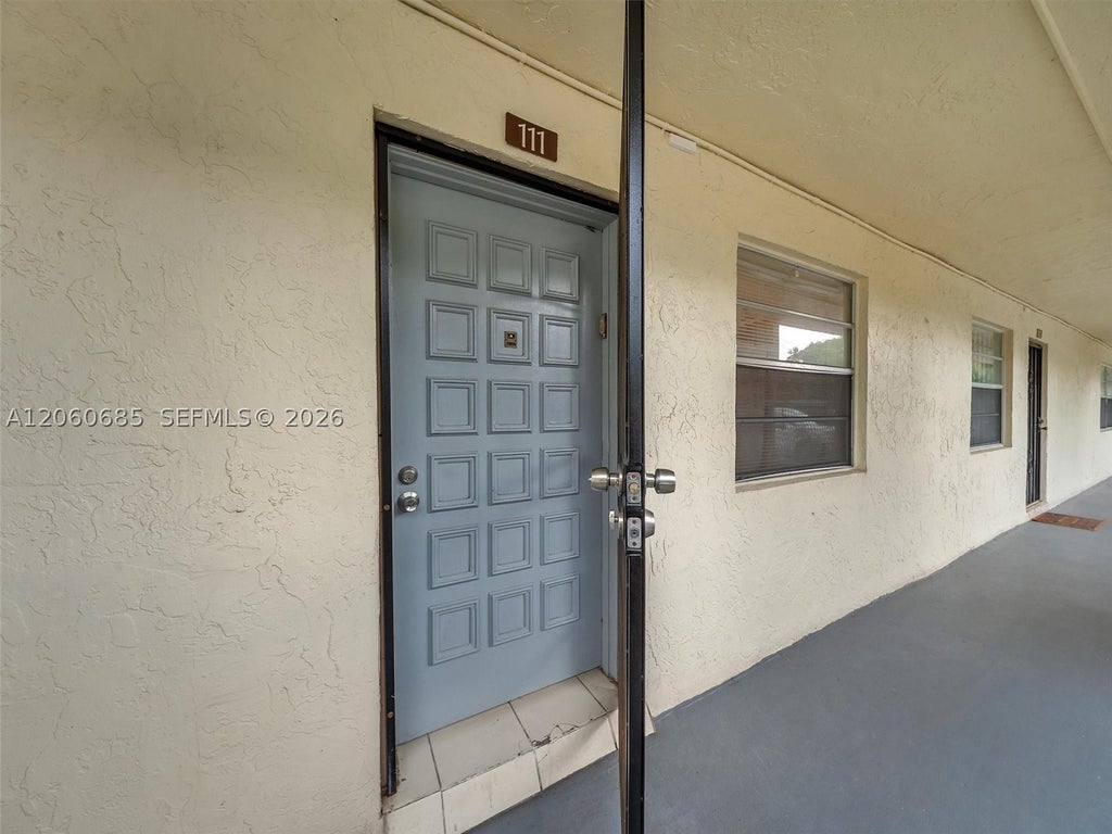 Photo of 3070 NW 48th Ter #111, Lauderdale Lakes, FL 33313 (MLS # A12060685)