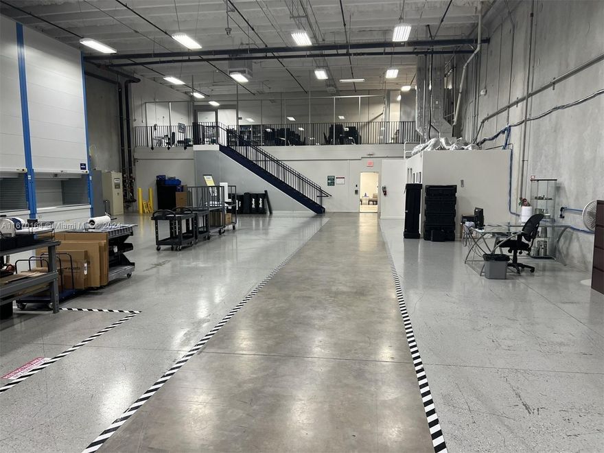 Class A condition 9,590 sf light industrial condo has 2,832 sf office, 6,758 of 24-foot clear height warehouse with 3 dock-height bay doors. The office and 4k sf of warehouse are climate-controlled. 16 assigned parking spaces. Located in Park Centre Business Park near Golden Glades Interchange, providing excellent highway access. Offices have modern, high-end finishes, floor-to-ceiling glass walls, premium lighting, 2 private offices, spacious reception area, two open work areas, and a stylish break area. Two upgraded restrooms are in warehouse, with a 3rd executive/guest bathroom in office. Power is 440V, 3-phase. Remstar vertical loading and power generator available at additional cost.