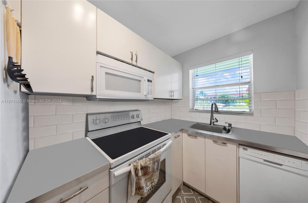 Photo of 581 Blue Heron Dr #205-B, Hallandale Beach, FL 33009 (MLS # A11674360)