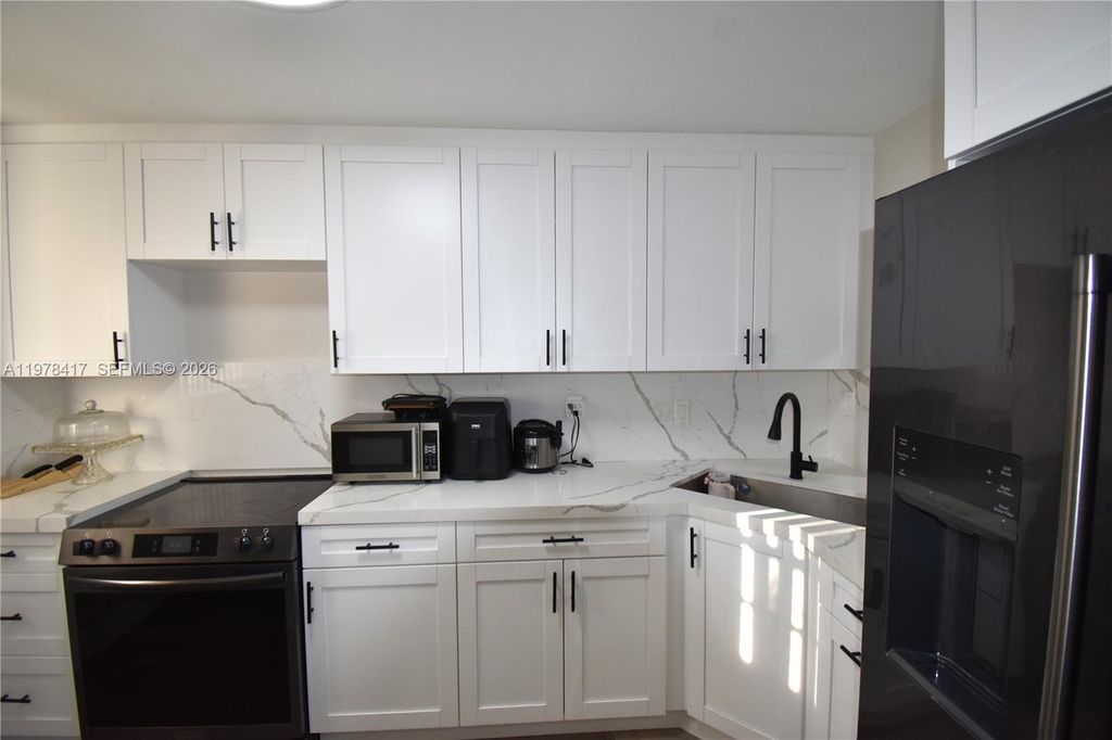 Photo of 7500 NW 17th St #102, Plantation, FL 33313 (MLS # A11978417)