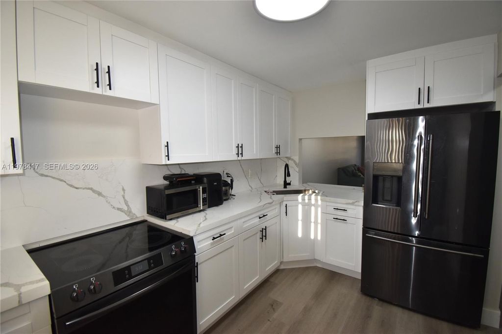 Photo of 7500 NW 17th St #102, Plantation, FL 33313 (MLS # A11978417)