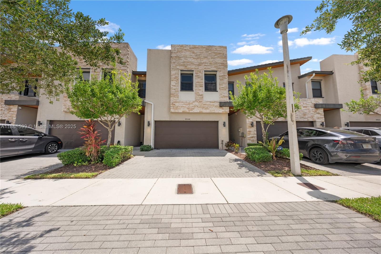 Discover your new home in the exclusive community at Park Central, Doral. This 4-bedroom residence (with 2 master suites) and 3.5 bathrooms offers elegance, comfort, and convenience. Designed for luxury and practicality, it features a cozy patio, parking for up to 5 vehicles, water-resistant wood floors, brand-new 5-ton A/C, and an upgraded Italian-style kitchen with modern appliances, wine cooler, custom TV furniture, and motorized blinds. High ceilings, stone accent walls, and wood finishes add warmth and sophistication. Enjoy 24/7 security in a prestigious neighborhood with top schools, supermarkets, restaurants, and parks nearby, plus access to Doral’s premier resort-style clubhouse where every day feels like a vacation.
