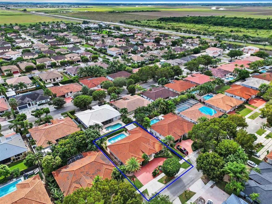 Exquisite Single-family residence with no HOA, ideally situated in the heart of The Hammocks. This impeccably maintained home offers an open-concept flow, impact windows, and elegant tile and porcelain flooring throughout. The kitchen and bathrooms have been tastefully remodeled with wood cabinetry and high-end appliances. The garage has been converted into an office room, featuring a window and storage, and can be easily converted back to a garage if desired. Enjoy a lush backyard retreat with pergola, paver patio, and ample room for entertaining. The circular driveway has been freshly resurfaced and painted. All sitting on a double foundation. Ideally located near parks, lakes, and shopping.