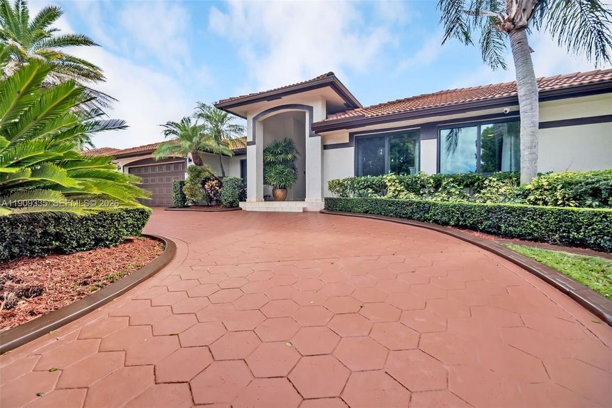 Exquisite Single-family residence with no HOA, ideally situated in the heart of The Hammocks. This impeccably maintained home offers an open-concept flow, impact windows, and elegant tile and porcelain flooring throughout. The kitchen and bathrooms have been tastefully remodeled with wood cabinetry and high-end appliances. The garage has been converted into an office room, featuring a window and storage, and can be easily converted back to a garage if desired. Enjoy a lush backyard retreat with pergola, paver patio, and ample room for entertaining. The circular driveway has been freshly resurfaced and painted. All sitting on a double foundation. Ideally located near parks, lakes, and shopping.