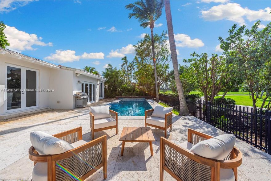 La Gorce Dr. and ON the Golf Course! More bedrooms, bathrooms and more sqft than the taxroll measuring 2900+ sqft. Enjoy the pool and open direct views of Historic La Gorce Golf Course. The Interior is classically finished with wood floors, open living areas, and vaulted ceilings in the Great Room. This house sits on a larger 8,640 sf lot. In addition, the property abuts a City Easement of 4000 sqf plus sqf that is usable and a game changer to the residents that call 5860 LG their home. 2 Car Carport. Easy to show.