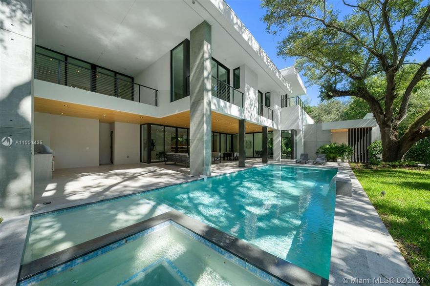 Miami Riches presents an exquisite, modern sanctuary built in 2020 and nestled among majestic oaks on a corner lot in exclusive Ponce Davis. Designed by renowned architect Jose Sanchez to perfectly integrate with its lush natural surroundings, the home offers high ceilings, floor to ceiling windows and warm elements. Close to the best schools in Miami, it has 6 bed, 6.5 bath, family room, den, covered terrace, pool/spa, outdoor kitchen, 2 car garage, 10 ft ceilings throughout, 15 ft high ceiling living/dining, security cameras/alarm and sound system. High-end designer finishes include: Scavolini kitchen and vanities, Subzero/Wolf appliances, Duravit/Graff/Hansgrohe baths, Italian doors, oak wood and Italian porcelain floors. Tenant occupied until end of March. Showings starting in March.