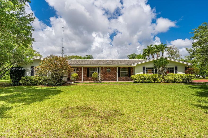 Spacious over 5,000 square feet HOME with 5 Beds/3 Bath with a Split Floor Plan, a private covered screen pool & a generously sized garage. This expansive 10-acre property, located in the eastern part of the Redlands, features 500 avocado trees & 3 Mango trees producing fruit. Spacious & bright two living rooms. Ample kitchen, plenty of storage & counter tops. A formal dining room. Many closets & walk-in closets. The house exterior wall is concrete. The roof has ceramic tile; wide and high windows & accordion hurricane shutters protect all windows & doors. Electric Well water supply & softener for the entire house. Outbuilding has water & electric connection. Ideal to have a Farm, Dream Home, or Bed & Breakfast Facility. You may divide the 10 acres of land into two 5-acre parcels.