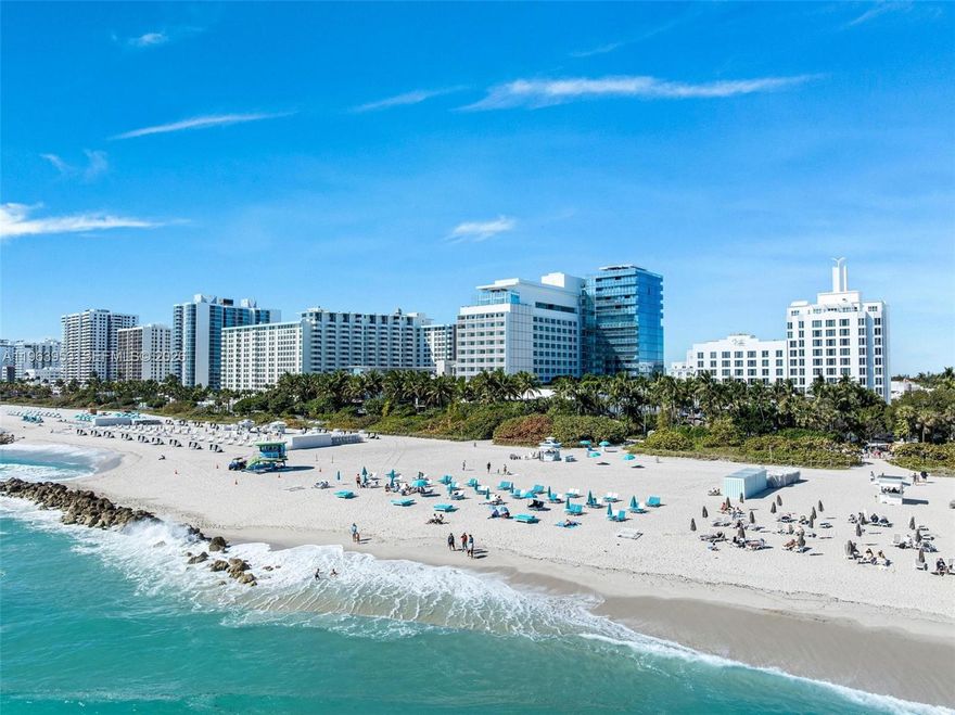 The EDITION Miami Beach offers a rare blend of scale, privacy, and full access to one of Miami's most coveted resort experiences. This boutique modern glass tower, comprised of just 23 residences, sets the stage for an expansive 4-bedroom, 4.5-bath home where floor-to-ceiling glass windows frame sweeping ocean and city views, filling the home with natural light. Interiors by Ian Schrager reflect a minimalist yet luxurious aesthetic, with materials selected for both beauty and durability. Signature bleached teak wood flooring runs throughout the main living areas, creating warmth and continuity. Generous living and dining spaces flow seamlessly onto a large wraparound terrace—ideal for enjoying sunrise ocean views and sunset city lights. The open Bulthaup kitchen, designed by John Pawson, is both refined and functional, featuring premium Miele and Sub-Zero appliances. Thoughtfully integrated into the main living space, it is perfectly suited for everyday living and effortless entertaining. Custom Lutron lighting throughout enhances the residence’s ambiance day and night. Ownership includes privileged access to the EDITION’s world-class amenities, including acclaimed restaurants, multiple pools, a full-service spa, state-of-the-art fitness center, dedicated beach service, bowling alley, ice-skating rink, and 24-hour concierge. The EDITION delivers a lifestyle that transitions effortlessly from a private coastal retreat to the vibrant social energy that defines Miami Beach.