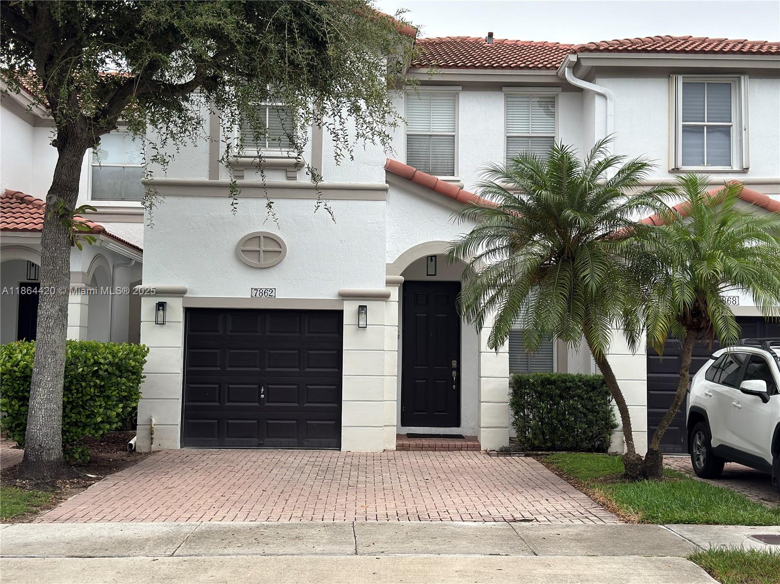 Islands at Doral – Stunning 4-bedroom, 2.5-bathroom home featuring new flooring on the first floor. The kitchen features stainless steel appliances, a brand-new refrigerator, and granite countertops.
Custom-made closets in all bedrooms. Extras closets offer ample storage throughout the house. Enjoy a beautifully maintained patio with a retractable roof and elegant lighting – perfect for entertaining. The property includes a 1-car garage and a spacious driveway that fits up to 4 vehicles. Access to the Islands at Doral Clubhouse, featuring a pool, fitness center, basketball and tennis courts, a children's playground, a conference room, and more. 24-hour security patrol ensures peace of mind. Easy to show and move-in ready!