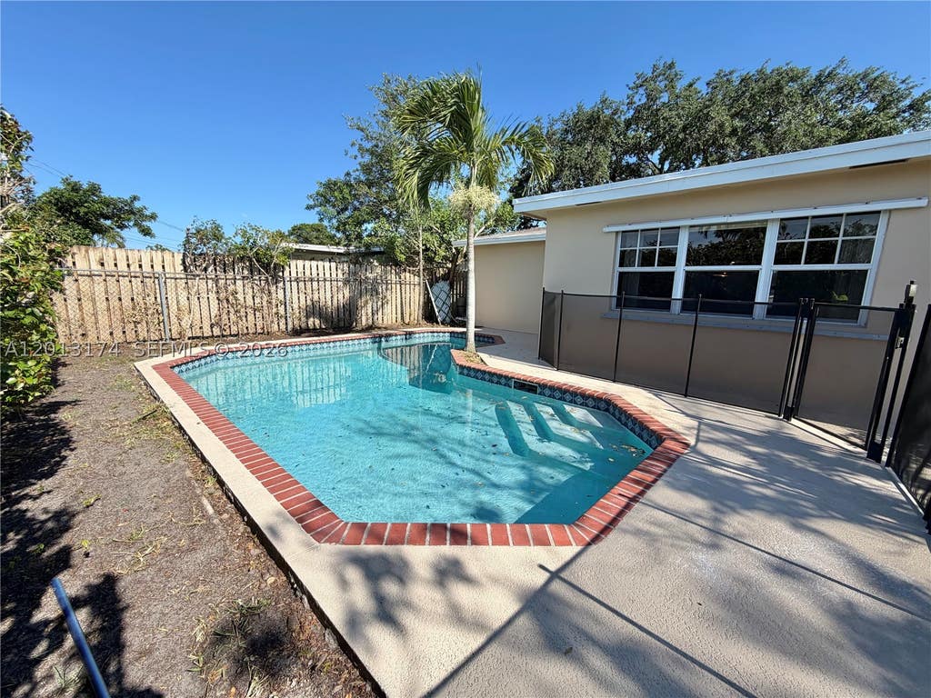 Photo of 9151 NW 21st Mnr, Sunrise, FL 33322 (MLS # A12013174)