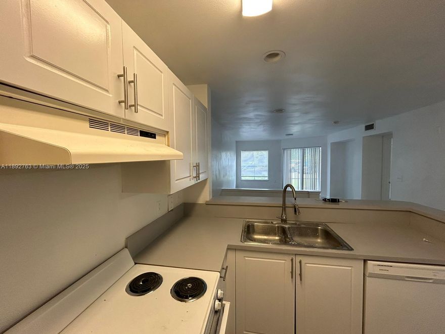 1nd Floor Unit in Gated Community, Step into this light and bright second-floor condo thoughtfully open floor plan and spacious walk-in closets for easy, modern living.Located in a gated community with amenities including a pool, fitness center, clubhouse, tennis courts beautifully landscaped walking paths.just minutes from I-95, the Turnpike, local restaurants, shopping, schools, airports & the stunning Palm Beach coastline move-in-ready condo